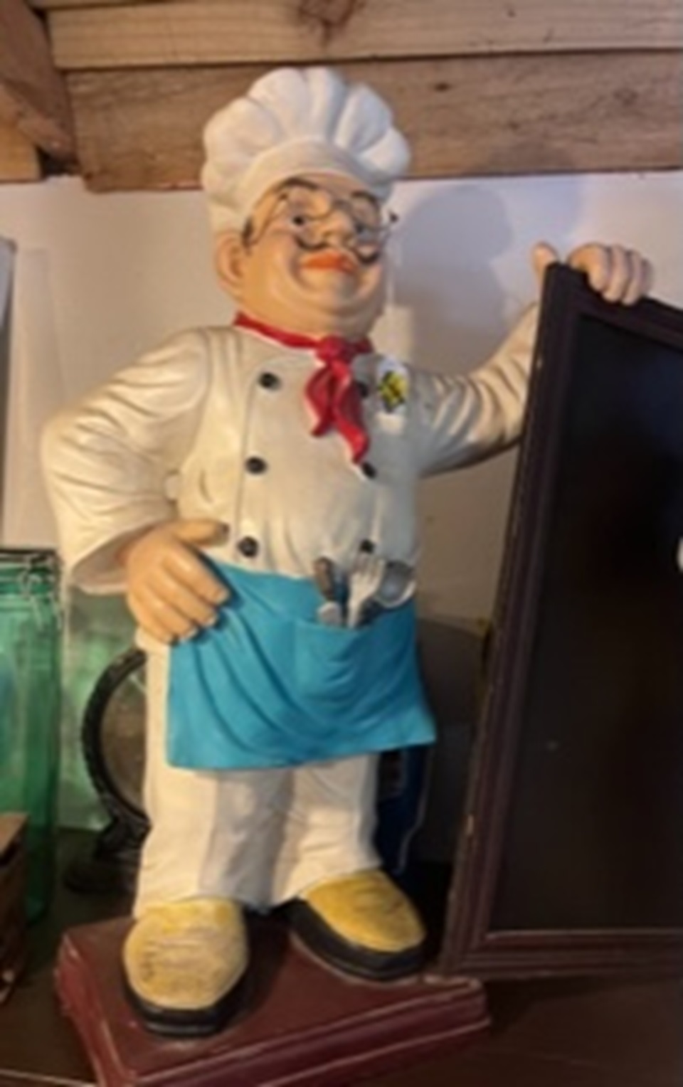 Chef statue holding board